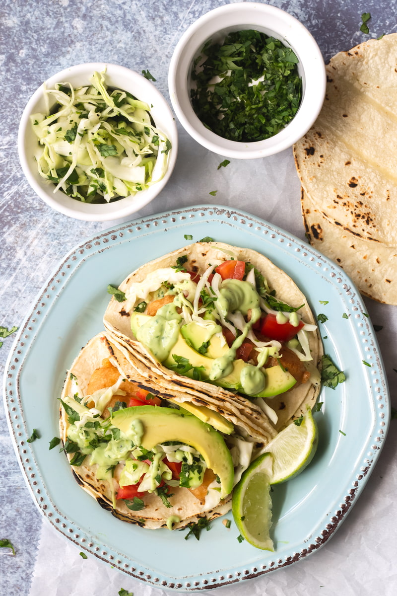 crispy baja fish tacos with avocado crema