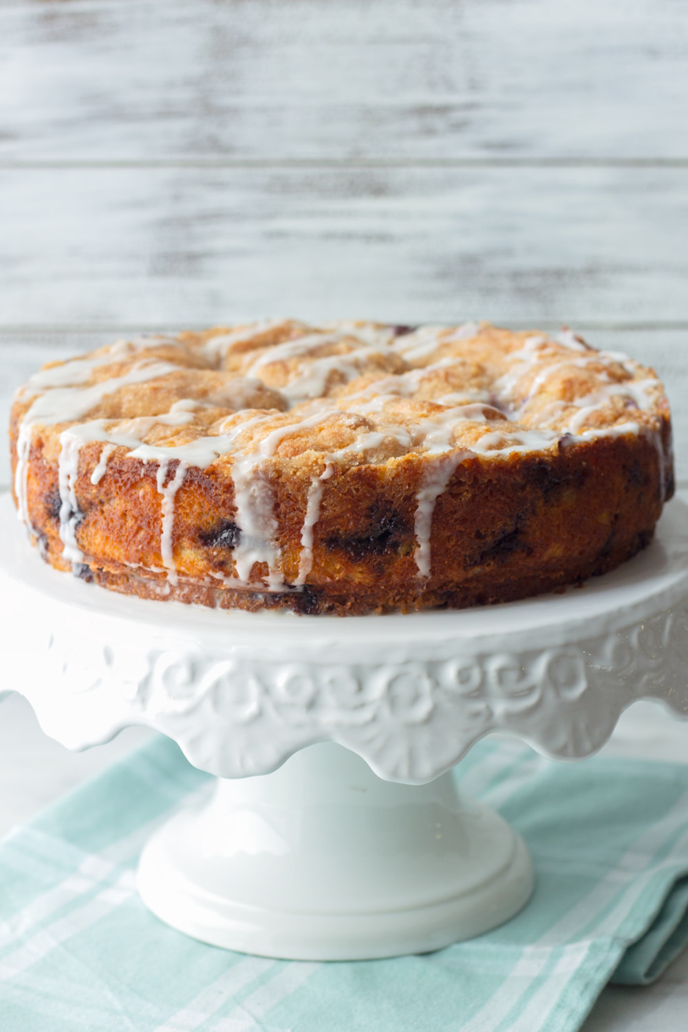 blueberry coffee cake on cake stand