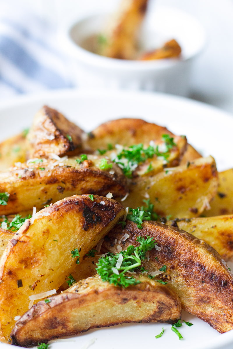 Extra Crispy Baked Garlic & Herb Potato Wedges - Baker by Nature