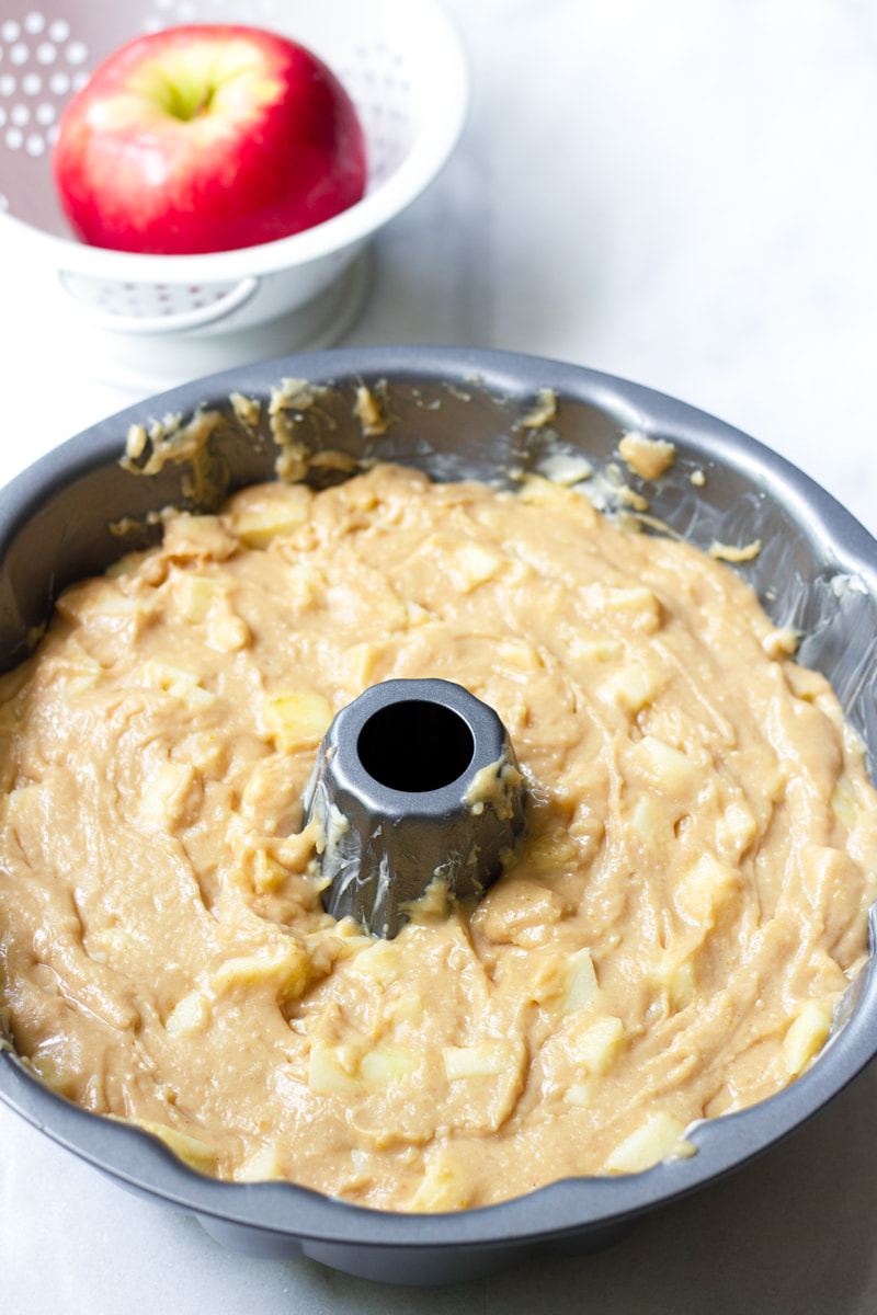 apple bundt cake batter in pan