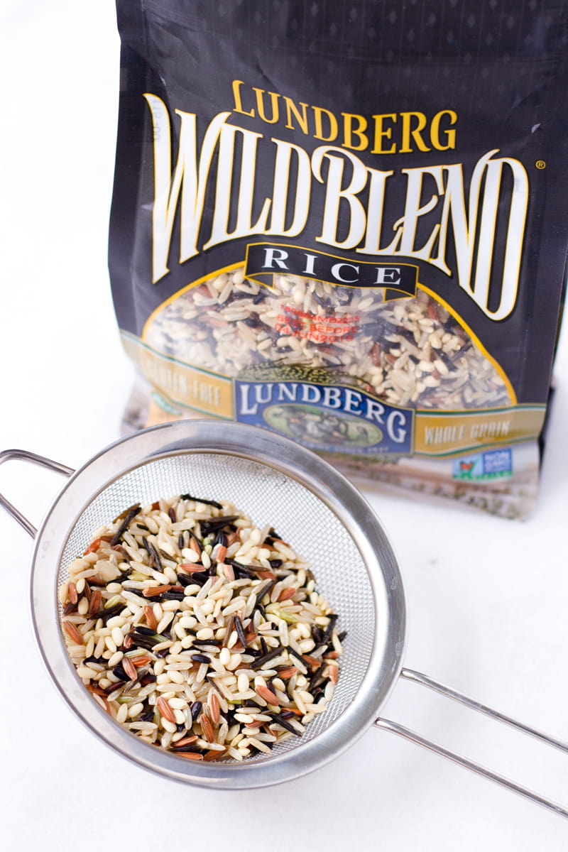 wild rice blend in a sieve with package in the back