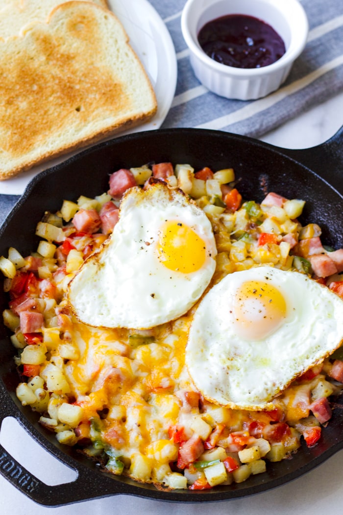 Cast Iron Skillet with Potatoes, Ham, Bell Peppers, Cheese, Egg