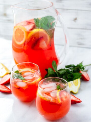 Two Glasses of Strawberry Lemonade with Lemon Slices