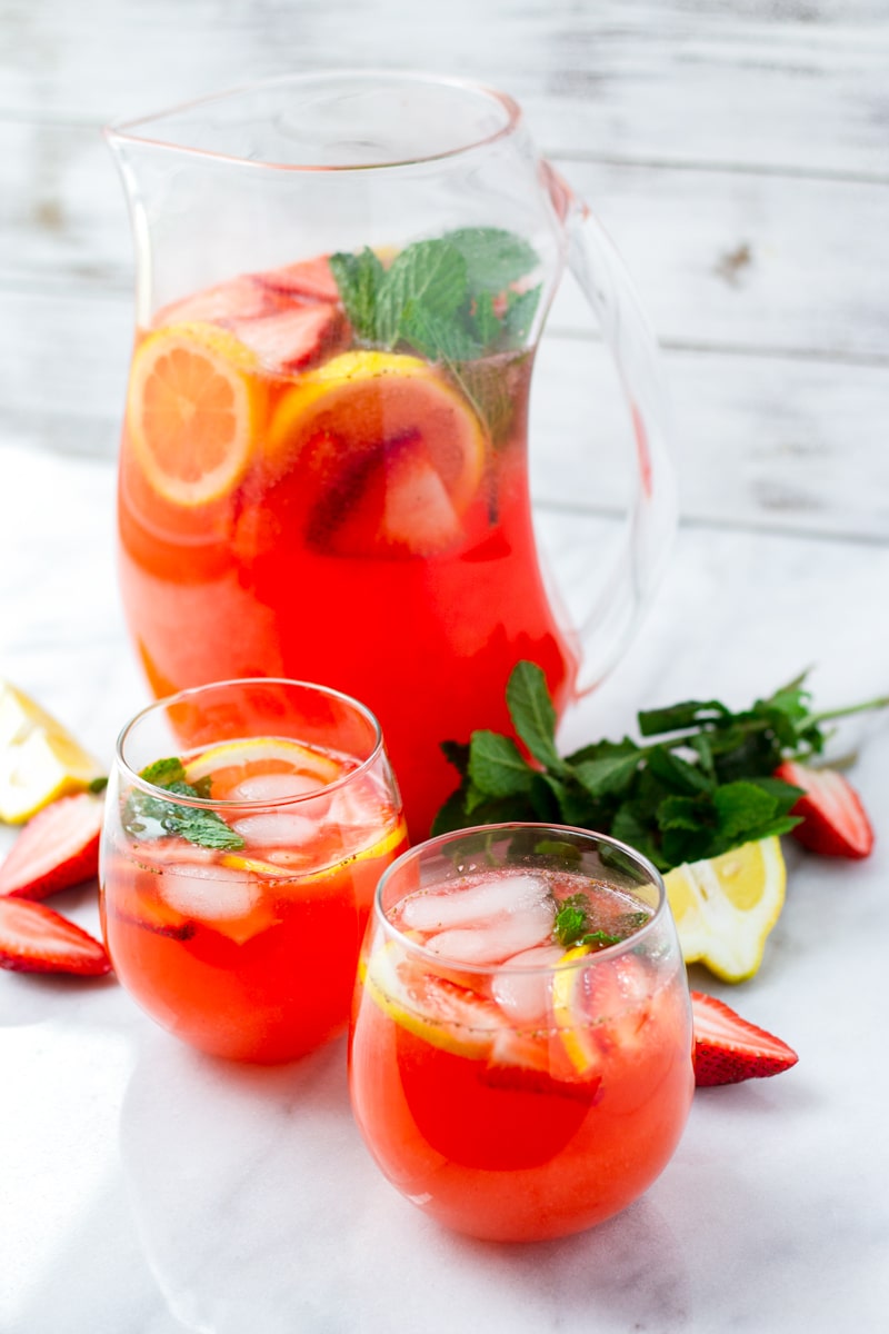 Two Glasses of Strawberry Lemonade with Lemon Slices