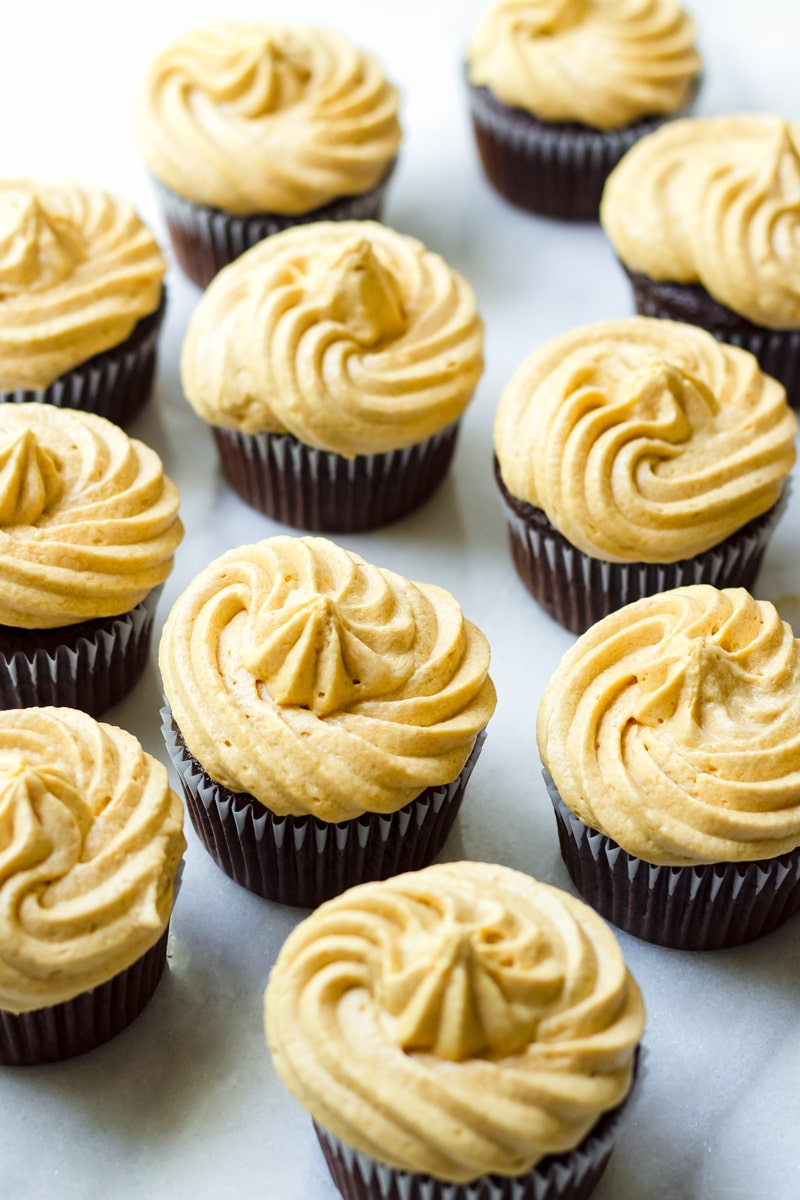 A Large Batch of Cupcakes Decorated with Frosting