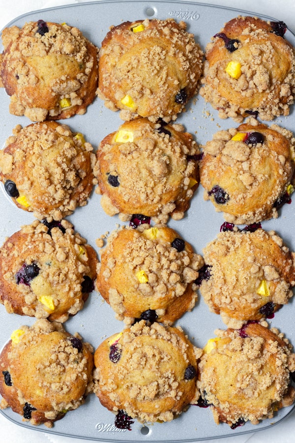 Blueberry and Peach Muffins in a Muffin Tin