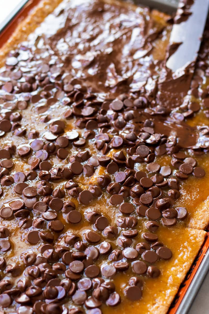 Spreading Chocolate Chips on Graham Cracker Toffee