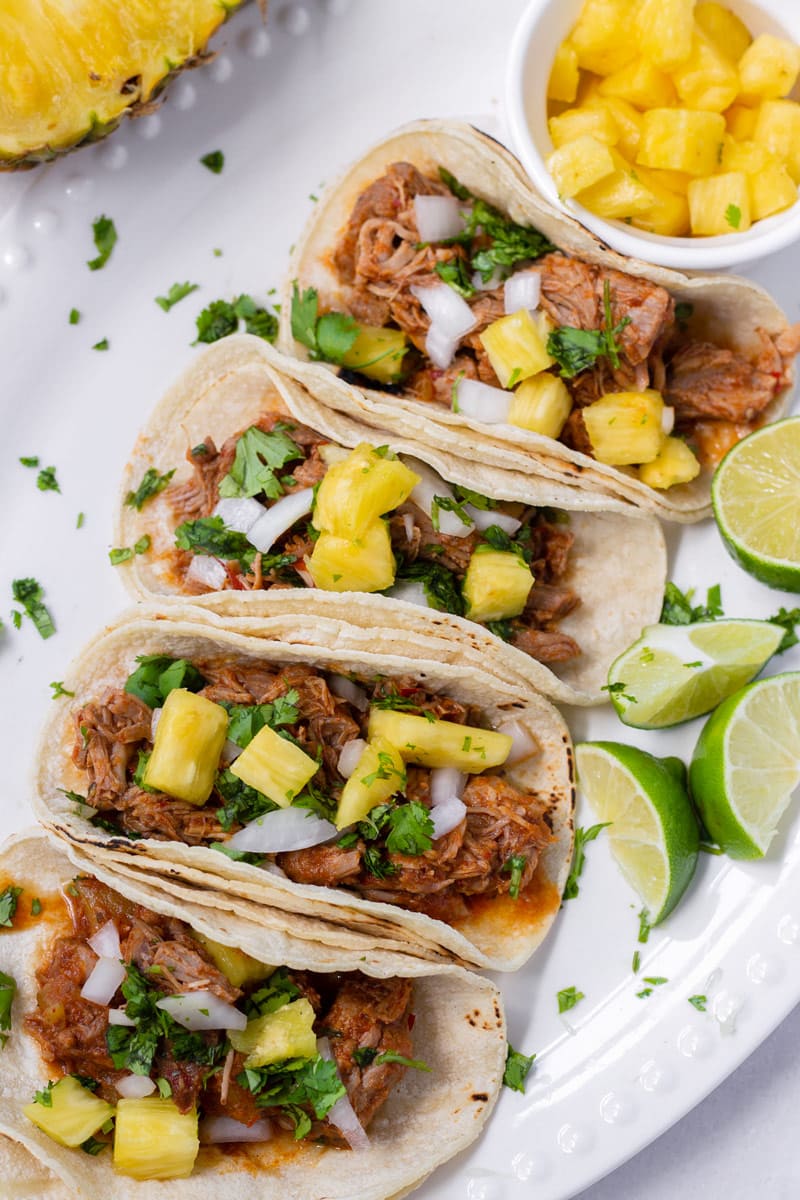 Al Pastor Tacos with Pineapples, Cilantro, and Lime Wedges