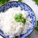 Close-up of an Asian-designed bowl with Coconut Rice Garnished with Cilantro