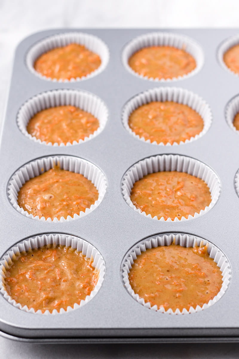 Batter for Carrot Cake Cupcakes in a Muffin Tin