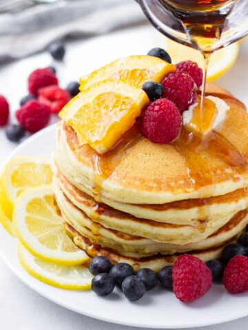 Lemon pancakes drizzled with maple syrup