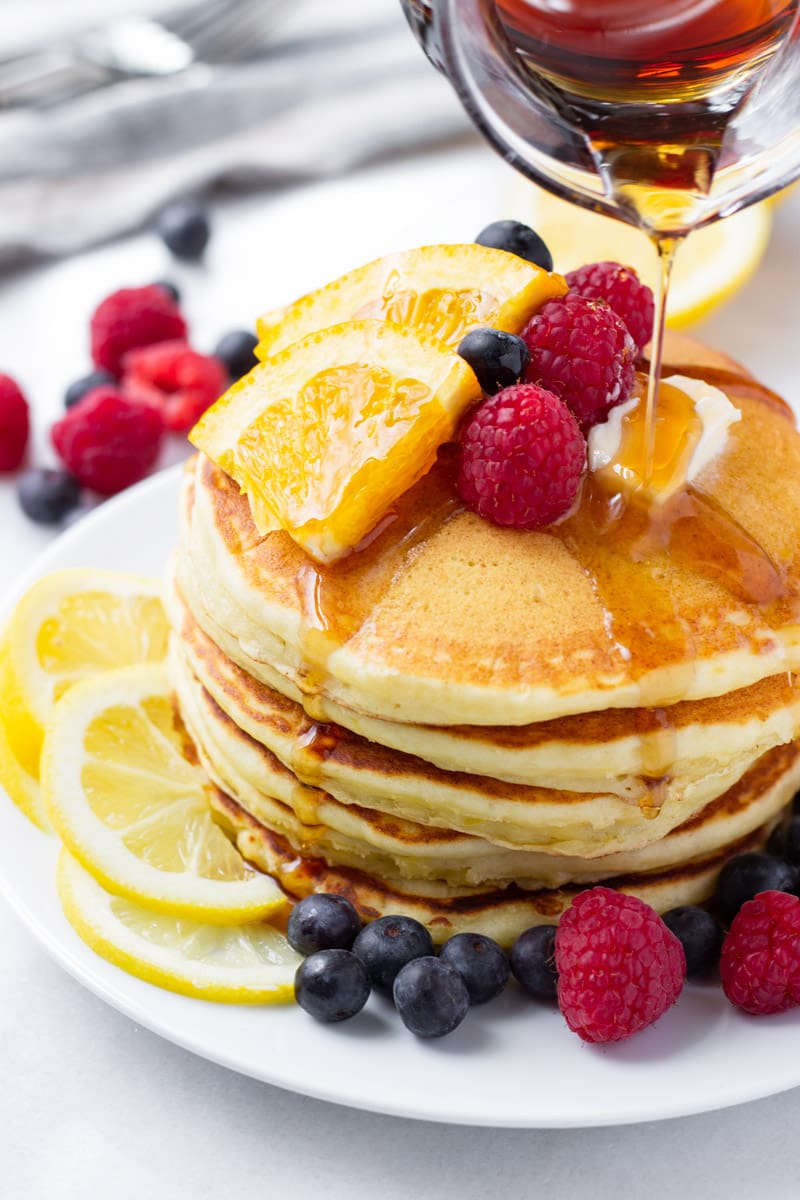 Lemon pancakes drizzled with maple syrup