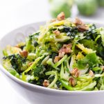 Bowl of Shaved Brussels Sprouts Salad with Walnuts and Kale
