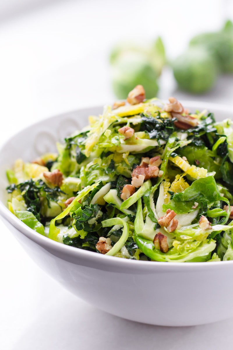 Bowl of Shaved Brussels Sprouts Salad with Walnuts and Kale