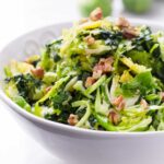 close up of shaved green salad with epcans