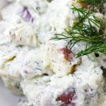 Close up of creamy potato salad with dill dressing