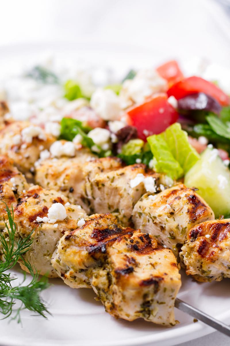side view of grilled Greek chicken kabobs