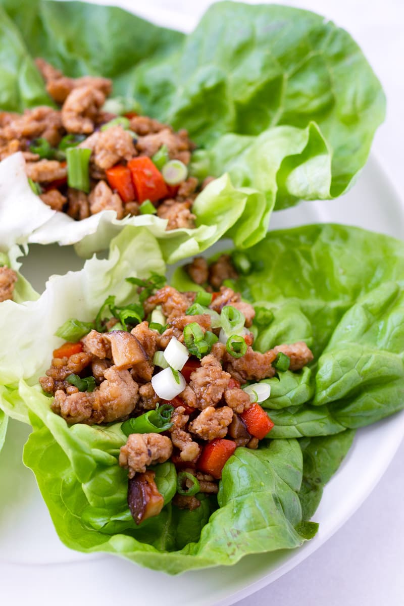 Two leaves of lettuce with Asian seasoned ground chicken filling