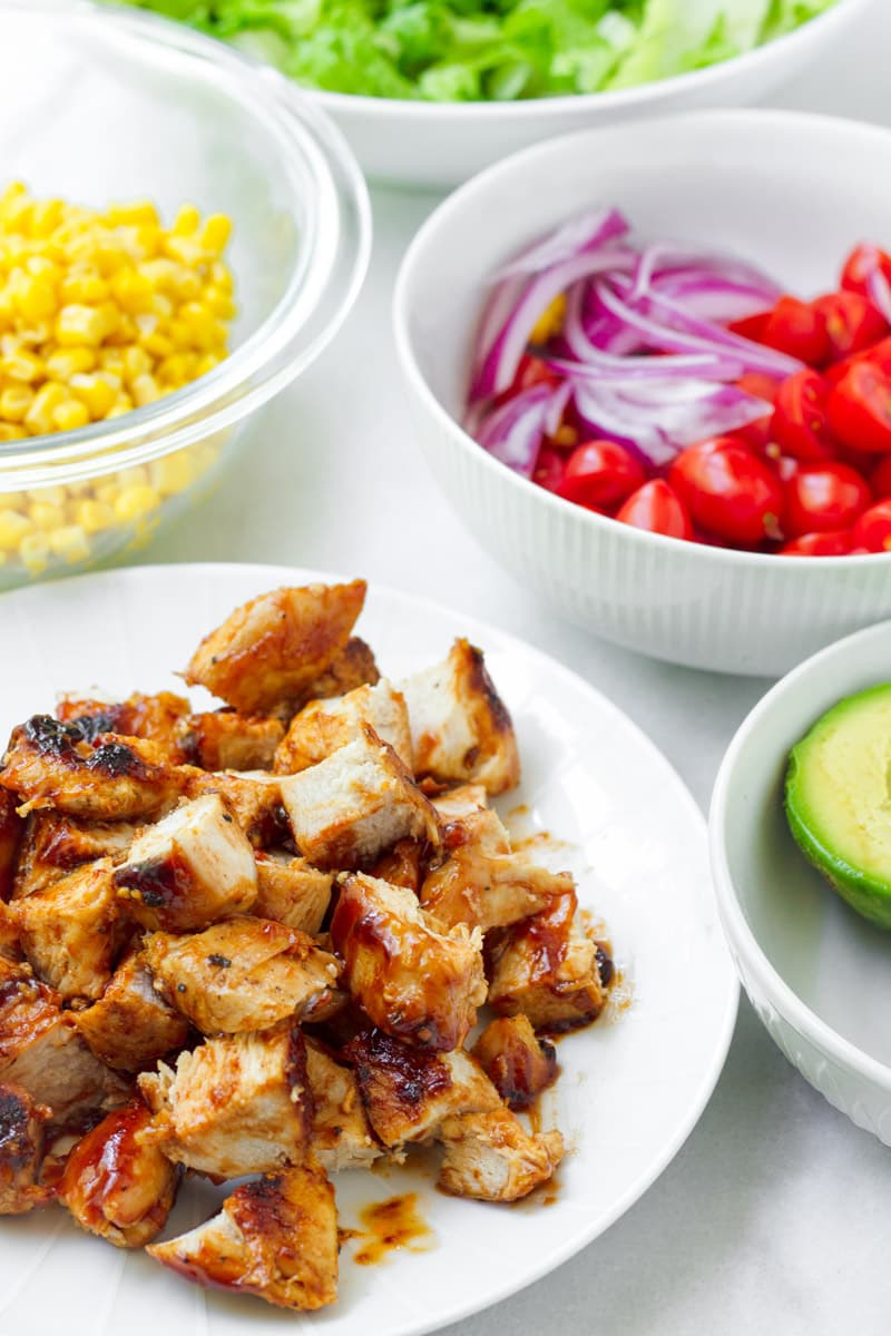 grilled chicken, corn, tomatoes, lettuce, and avocado