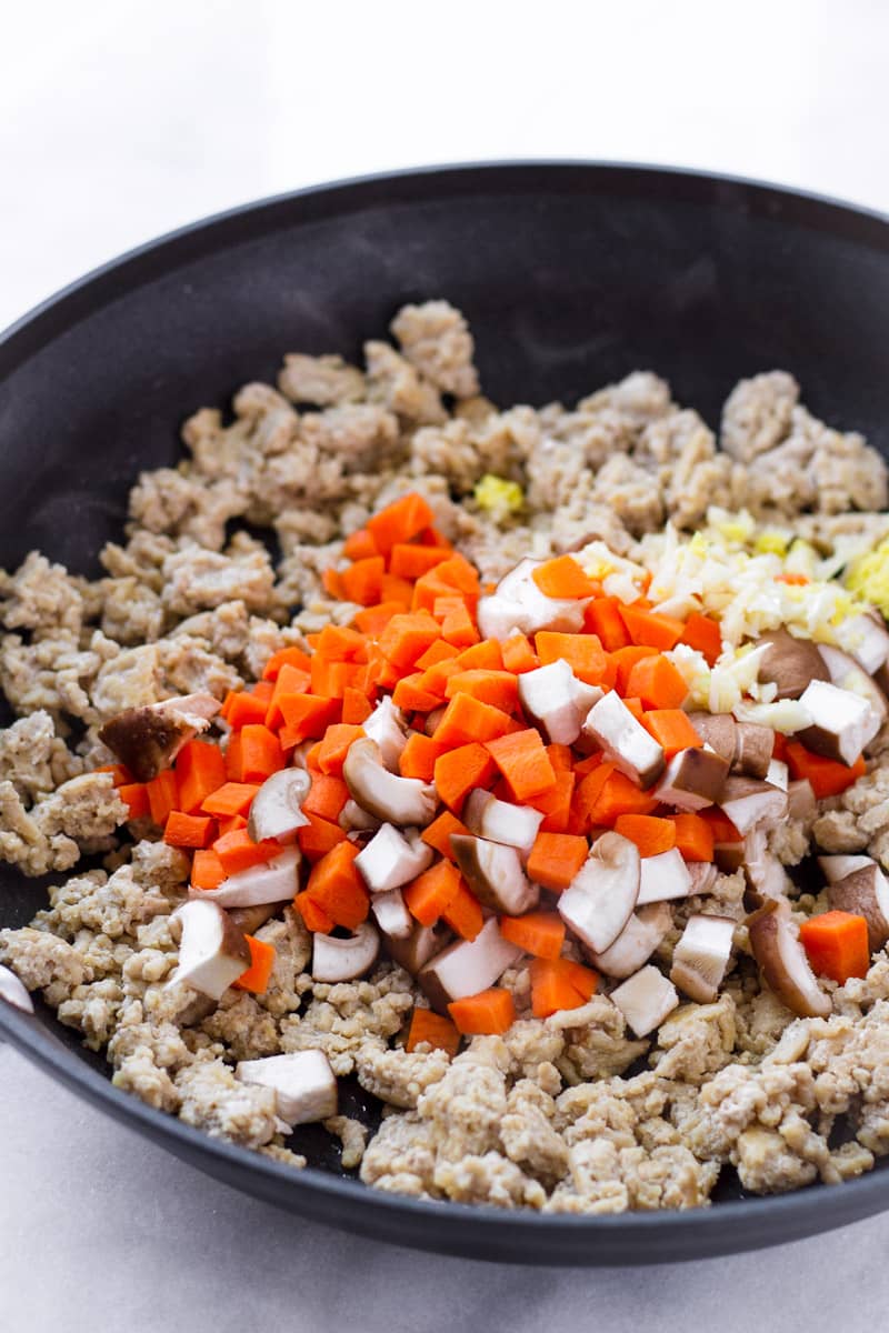 Skillet with ingredients for ground chicken filling