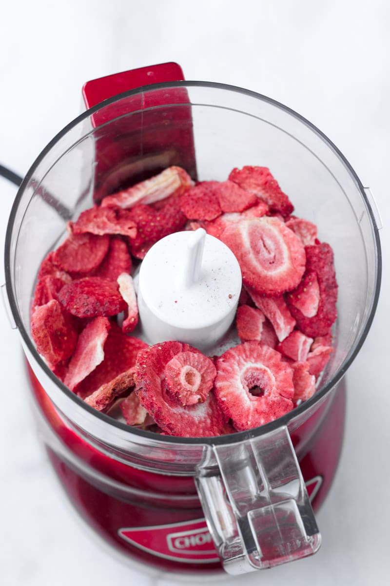 Freeze dried strawberries in a red food processor