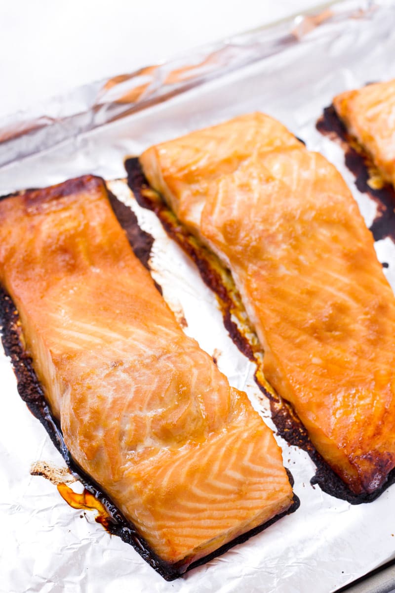 cooked salmon on a tray lined with foil
