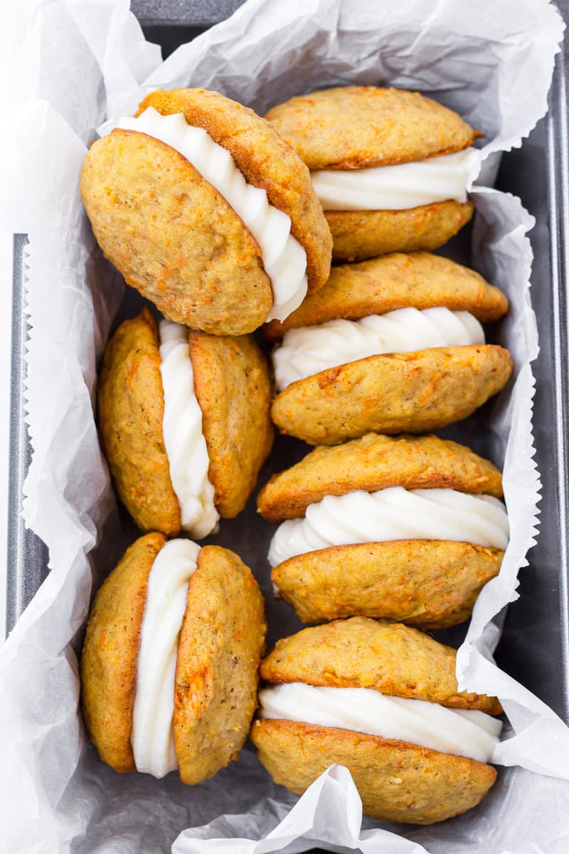 Top view of carrot cake sandwich cookies arranged in a loaf pan
