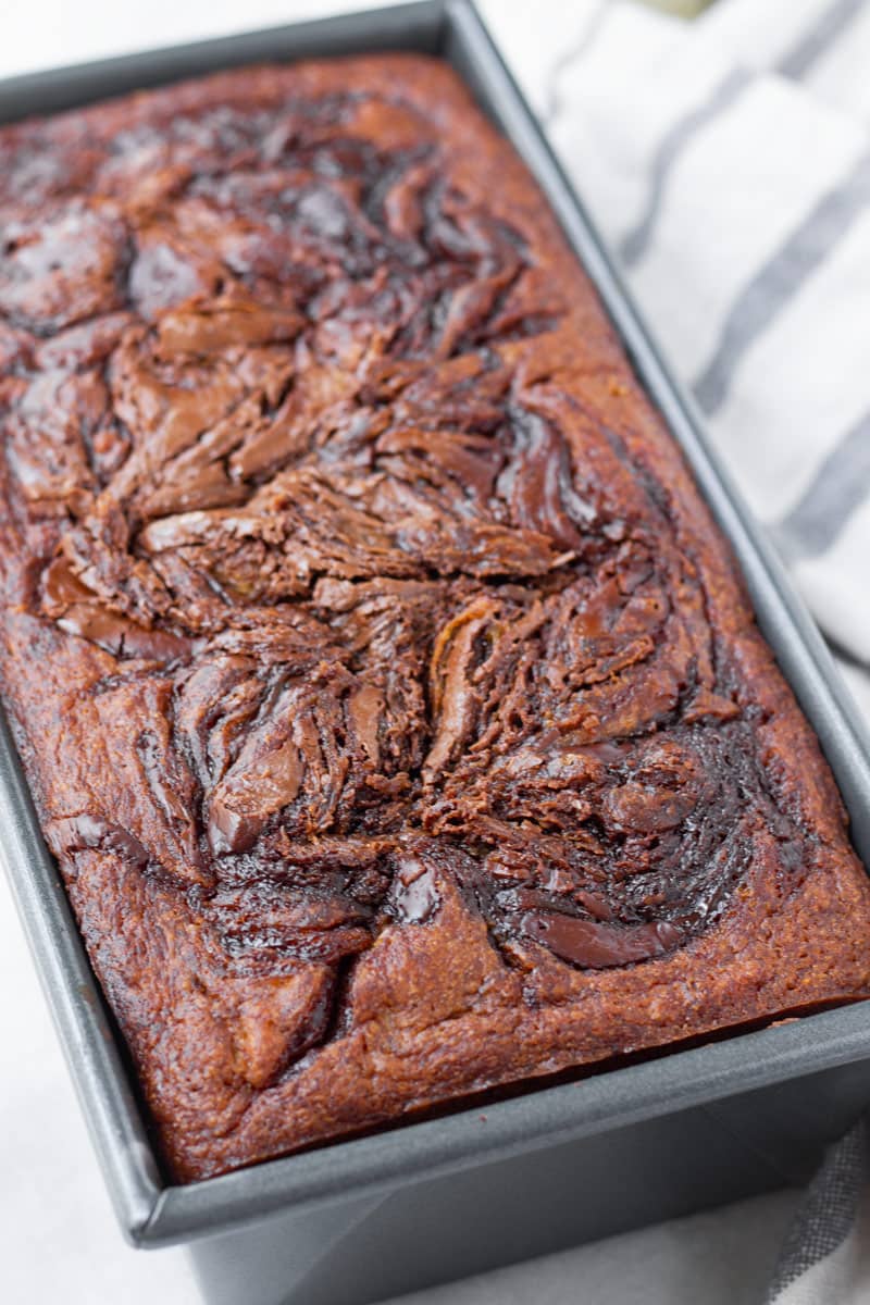 baked chocolate swirl banana bread in 9 by 5 pan