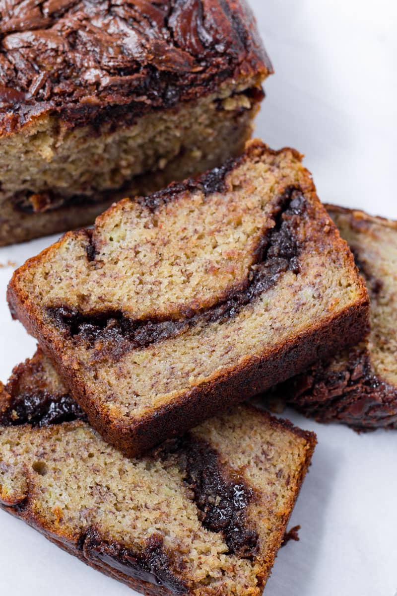 Stacked slices of baked banana quick bread with nutella