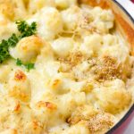 cheesy and golden brown cauliflower gratin in a red cast iron pot