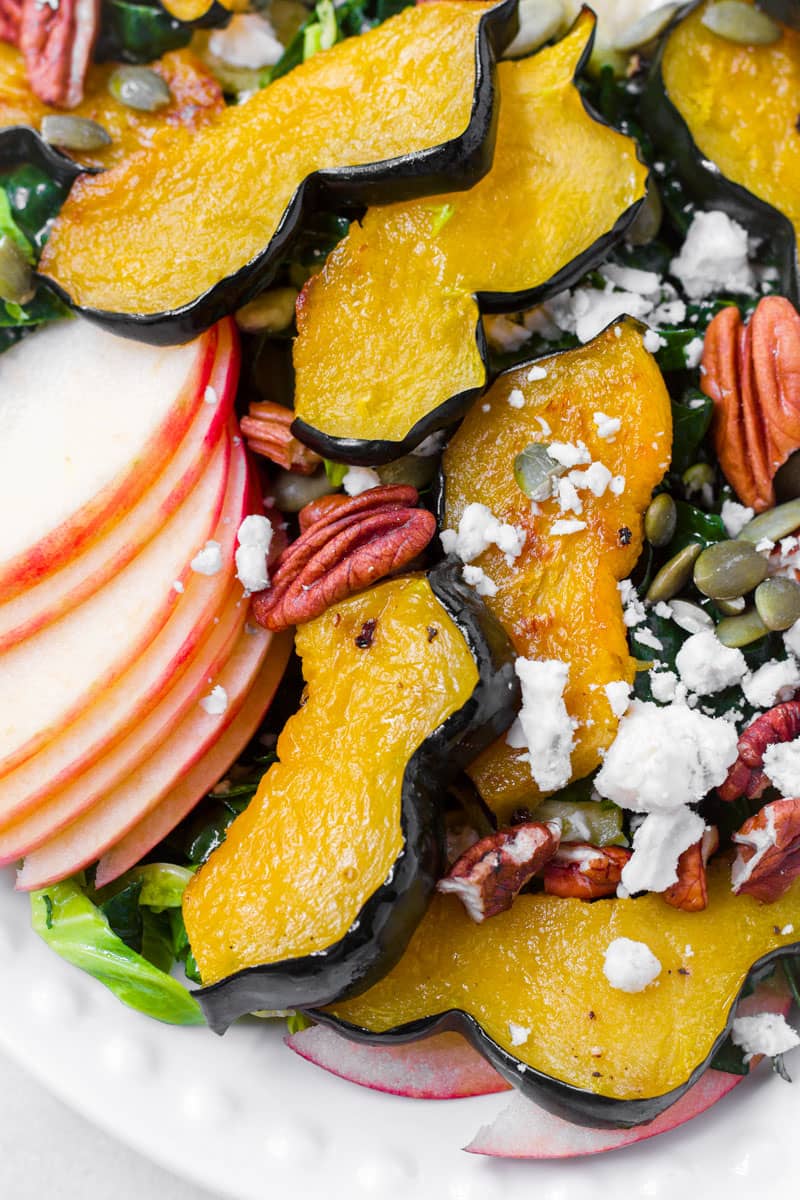 close up of sliced apples, roasted acorn squash, blue cheese, and nuts