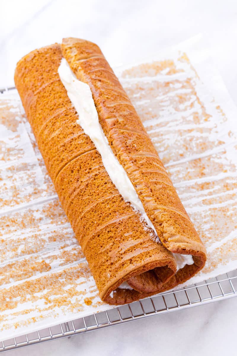 rolled up pumpkin cake with cream cheese filling