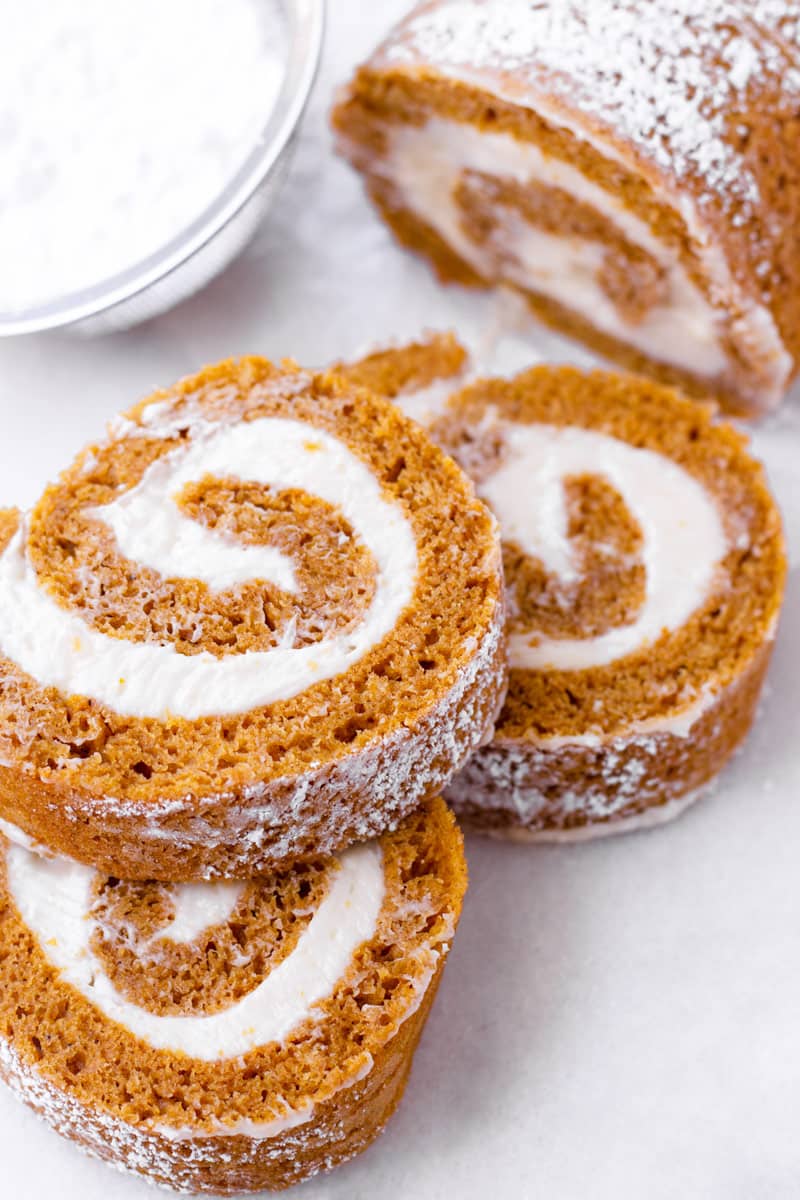 Three slices of pumpkin cake roll stacked