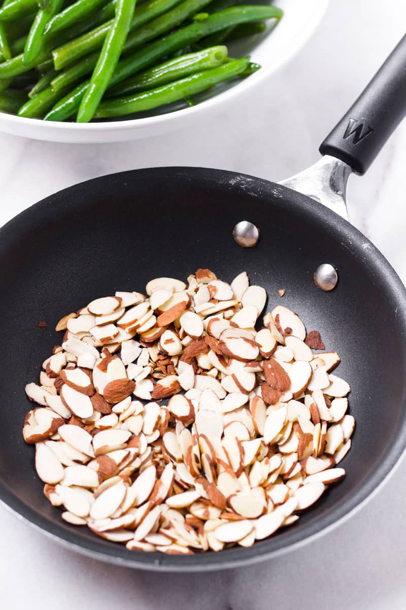 Toasted almonds in a small non stick pan