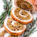 close up of baked roulade with herb sausage stuffing