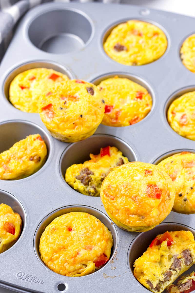 a muffin tin pan with baked breakfast egg cups