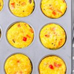 top view of baked sausage egg muffins in a muffin pan