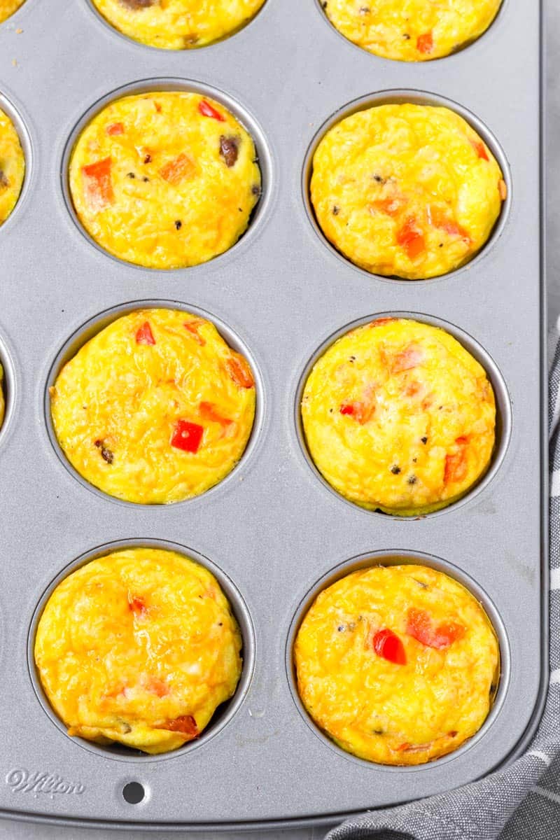 top view of baked sausage egg muffins in a muffin pan