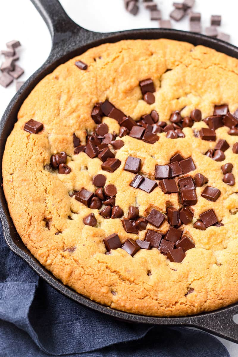 Baked golden brown chocolate chip cookie on a 10 inch cast iron skillet