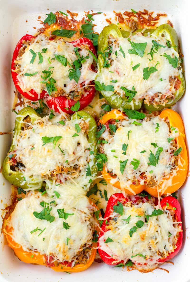 cheesy baked stuffed bell peppers garnished with parsley