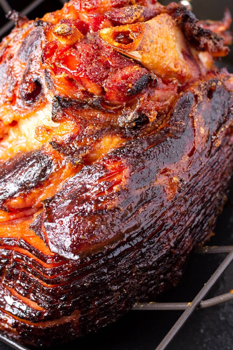brown sugar caramelized sliced ham on a roasting rack