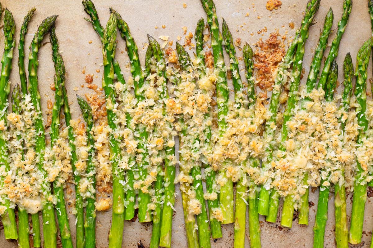 parmesan roasted asparagus with breadcrumb and cheese topping on sheet pan