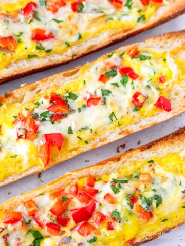 bread filled with baked egg and bell peppers