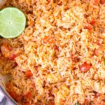 top view of easy tomato mexican rice with lime garnish
