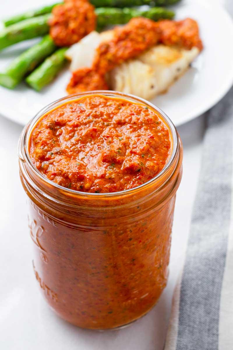 vibrant romesco sauce in a mason jar