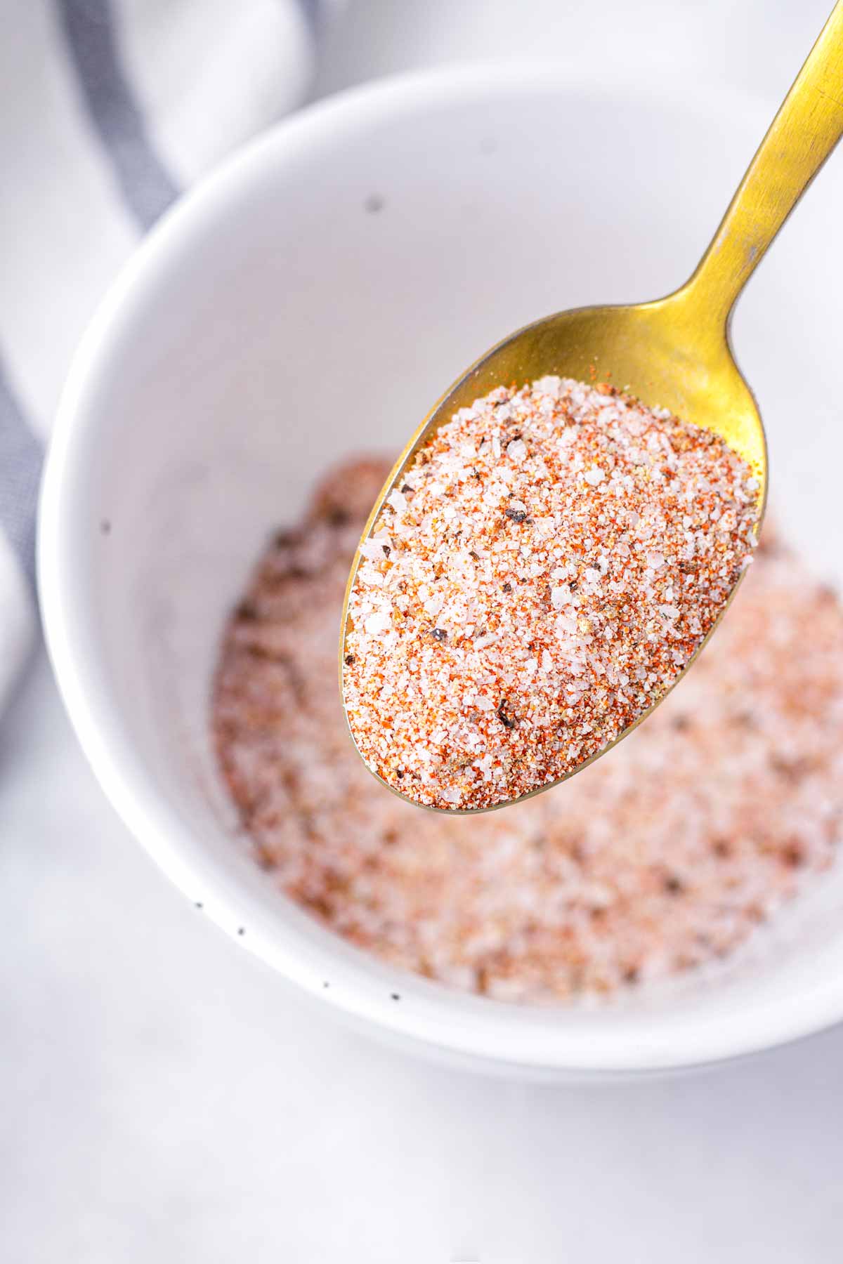 a spoonful of burger seasoning blend made with spices