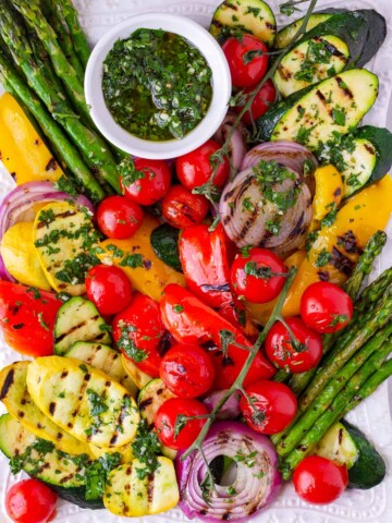 summer grilled vegetable platter with herb sauce on the side