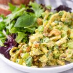 curried chicken salad with cashews, pistachios, and mixed greens