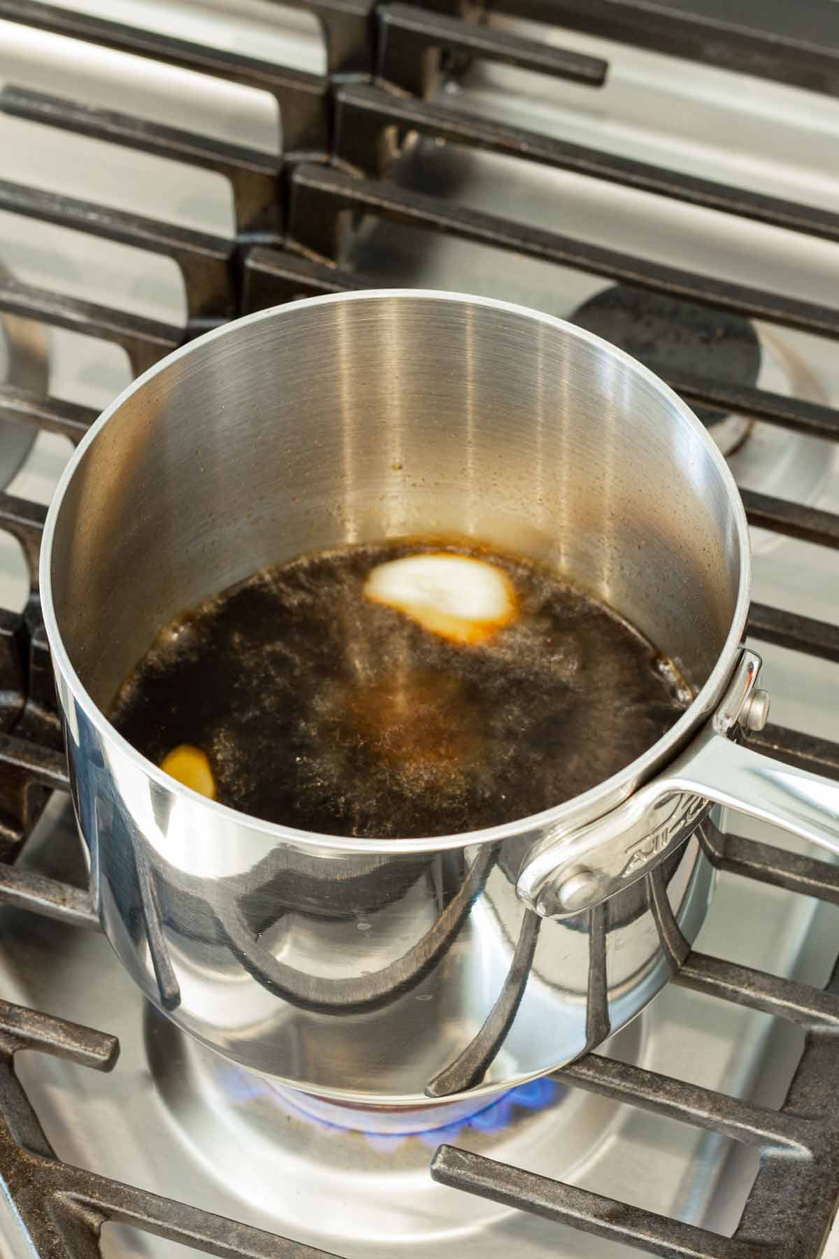 simmering teriyaki sauce in a small pot