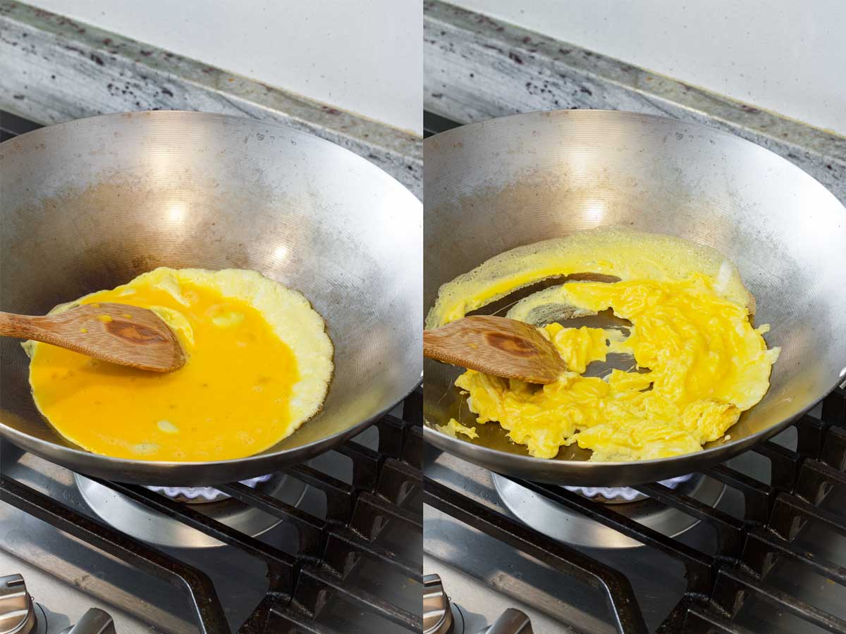 scrambling eggs in a large wok